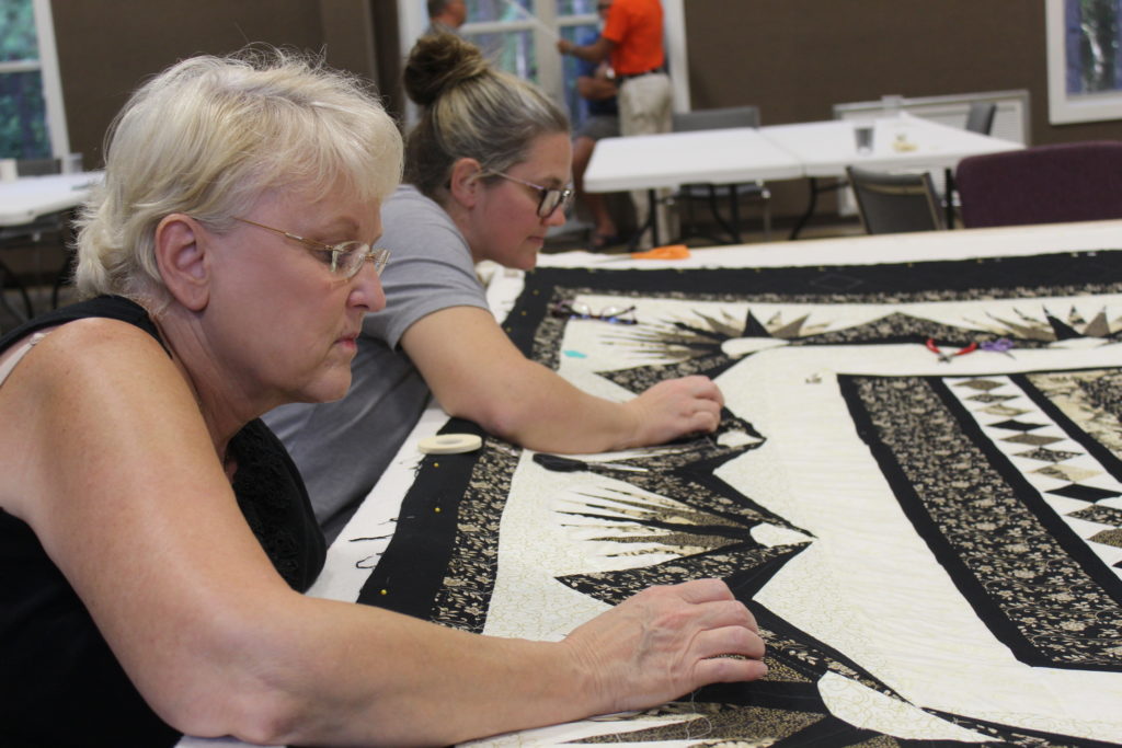Ladies quilting on the 2020 Camp Quilt